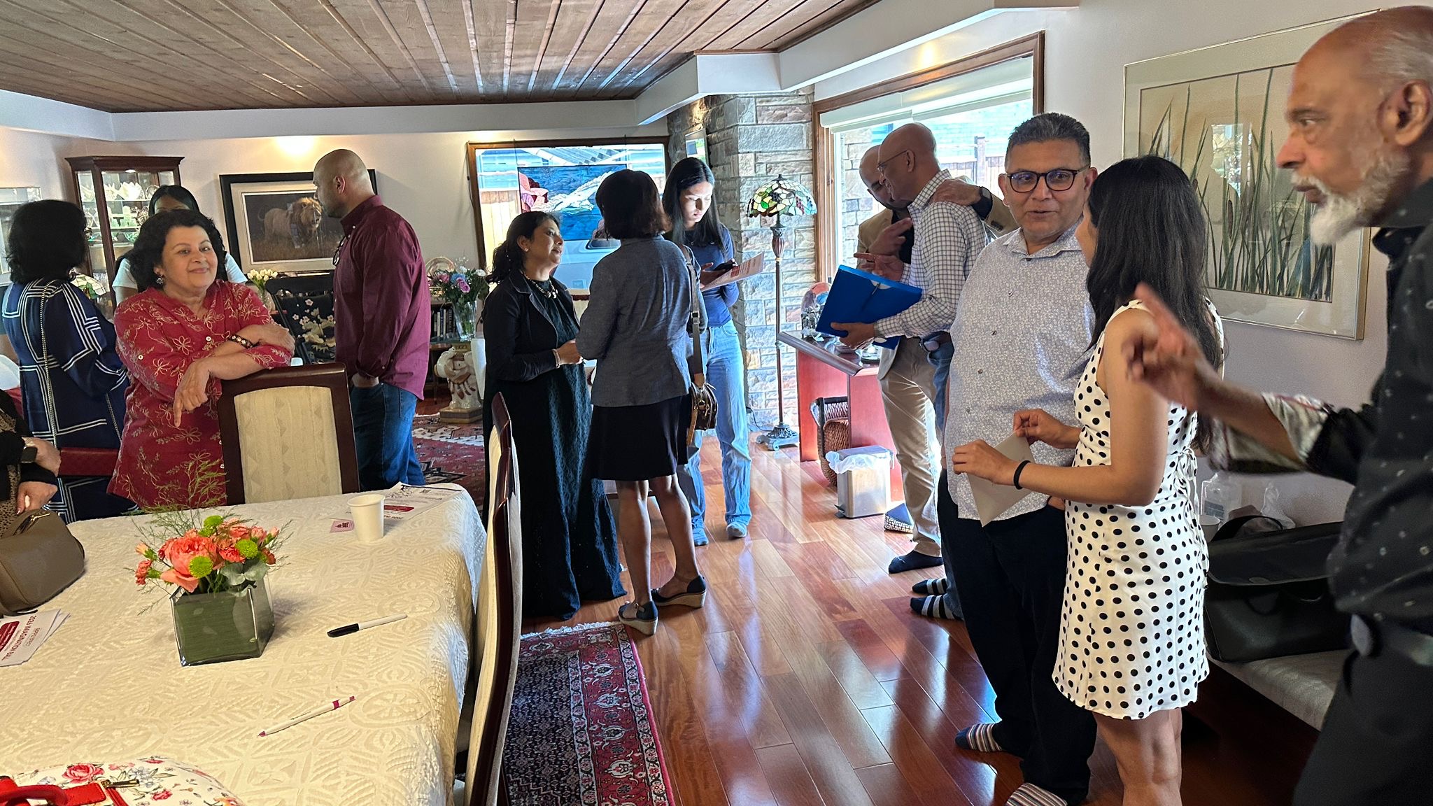 Members and guests gathering before the meeting begins