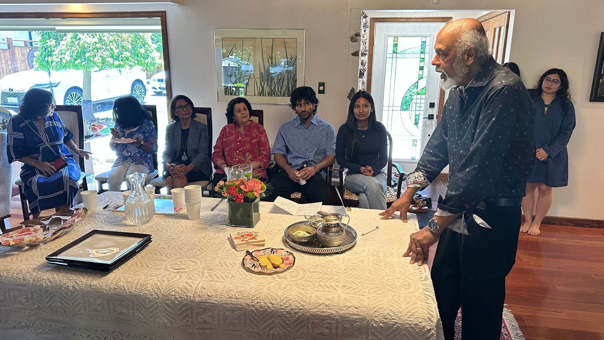 Dr Sudarshan Devanesen addressing members around the table