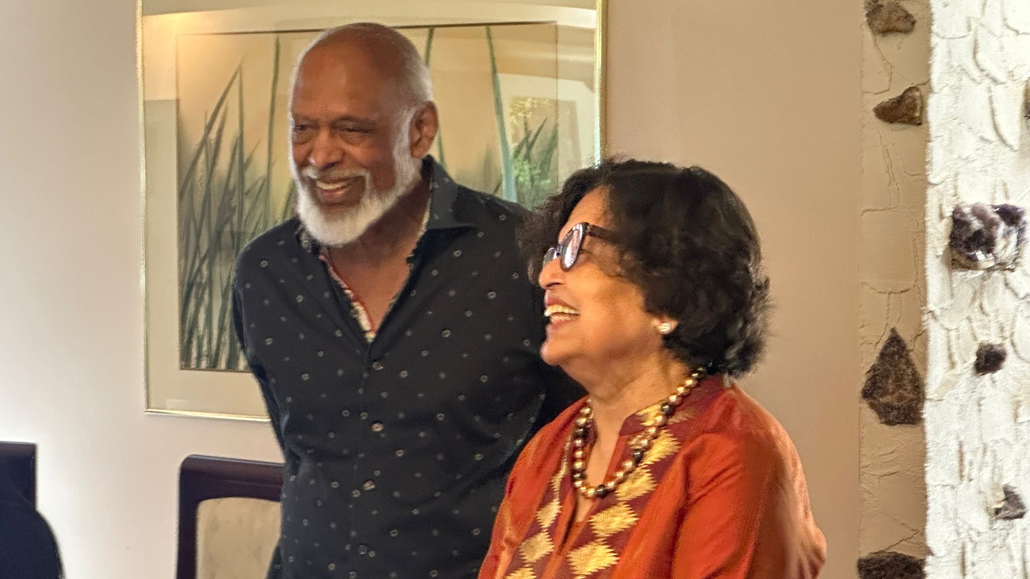 Two long-standing members sharing a moment of laughter