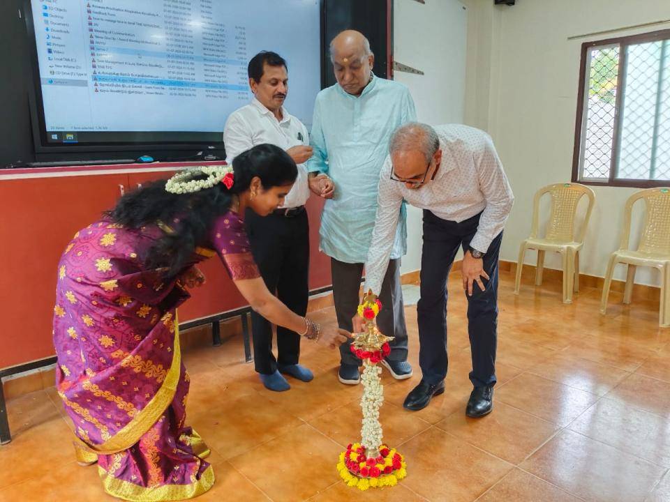 Guests lighting the ceremonial lamp to open the programme