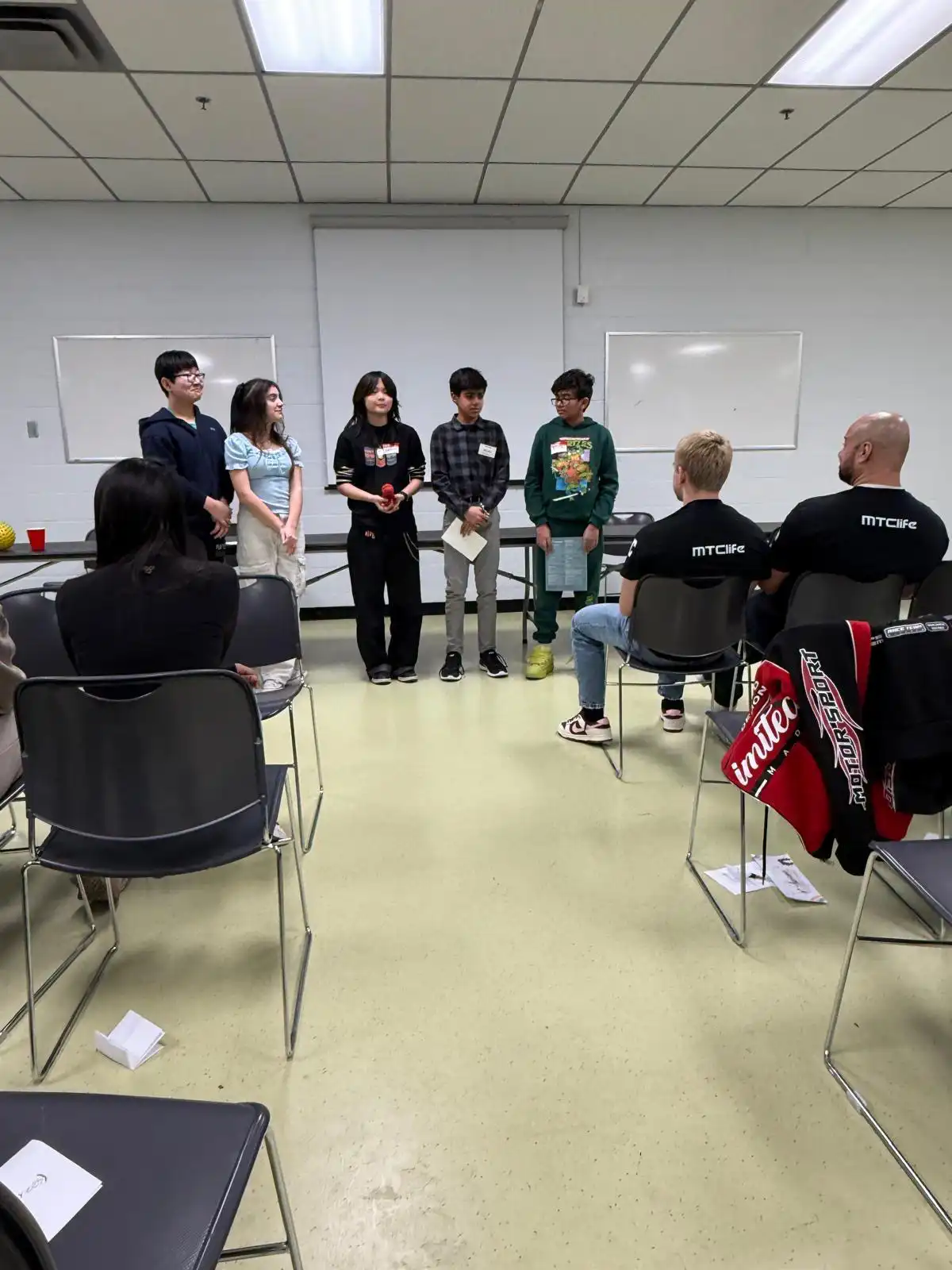 Students and MTC Life mentors in a discussion circle at Mental Health Day