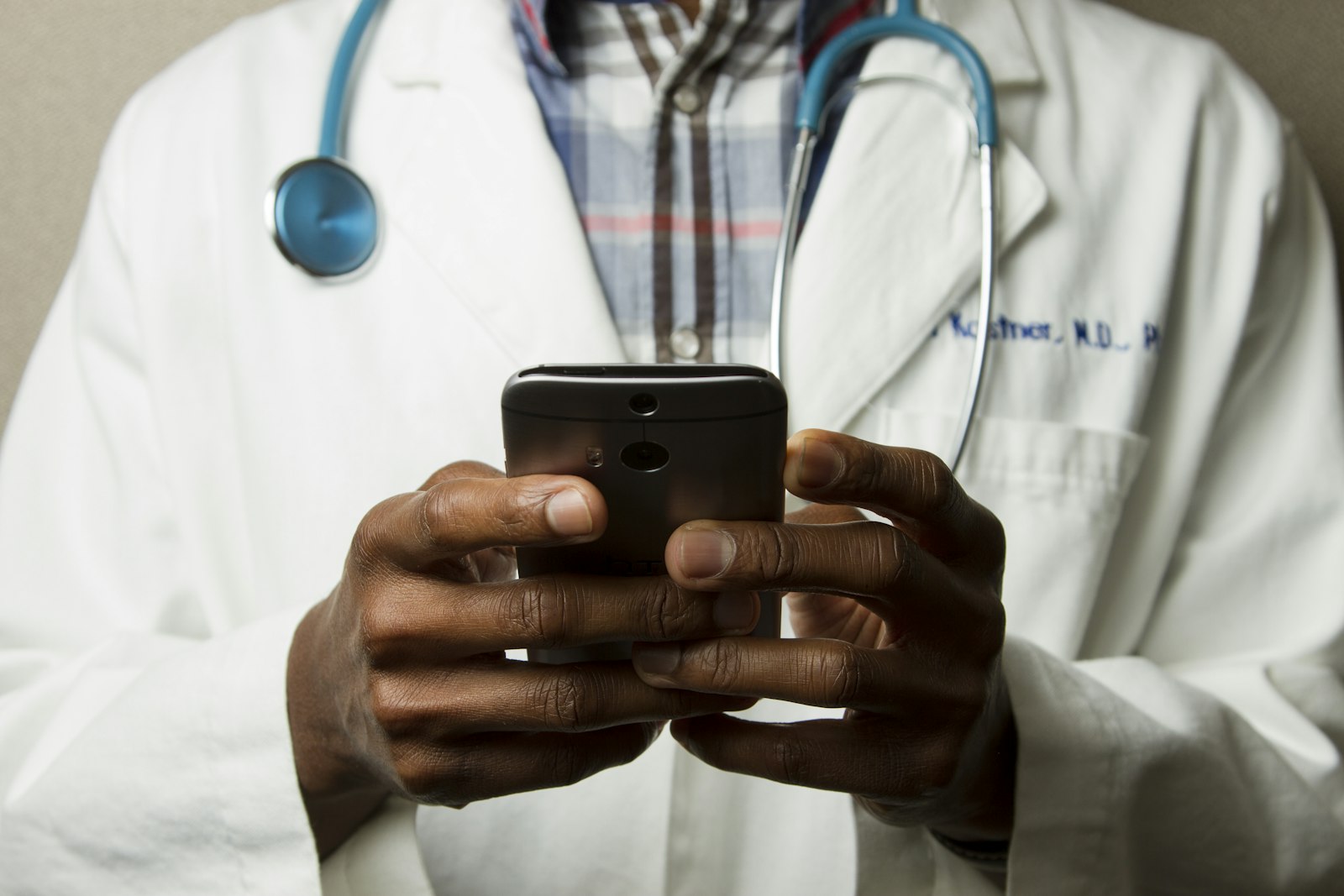 A doctor checking a phone